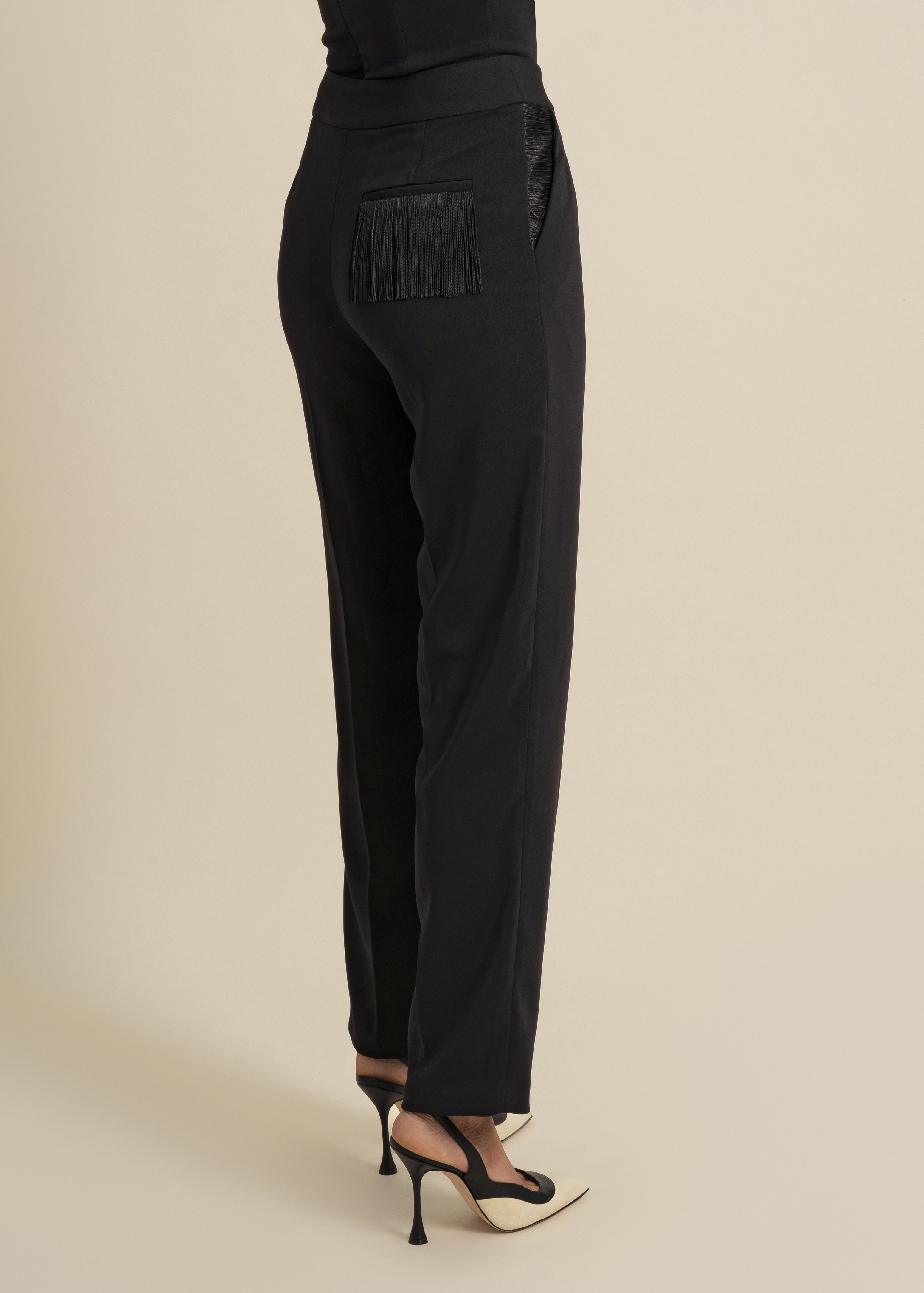 loose-fitted trousers with fringe accent