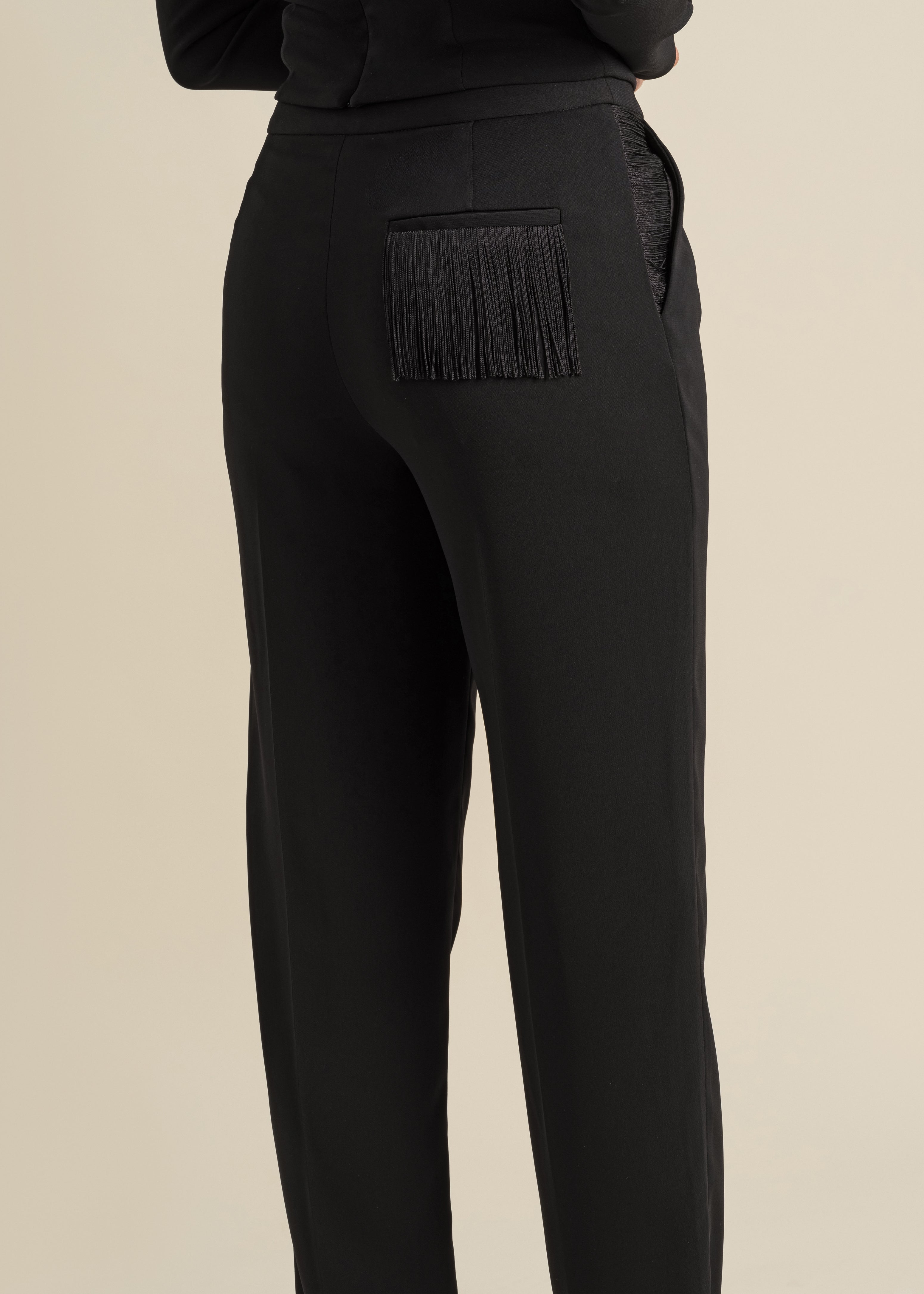 loose-fitted trousers with fringe accent