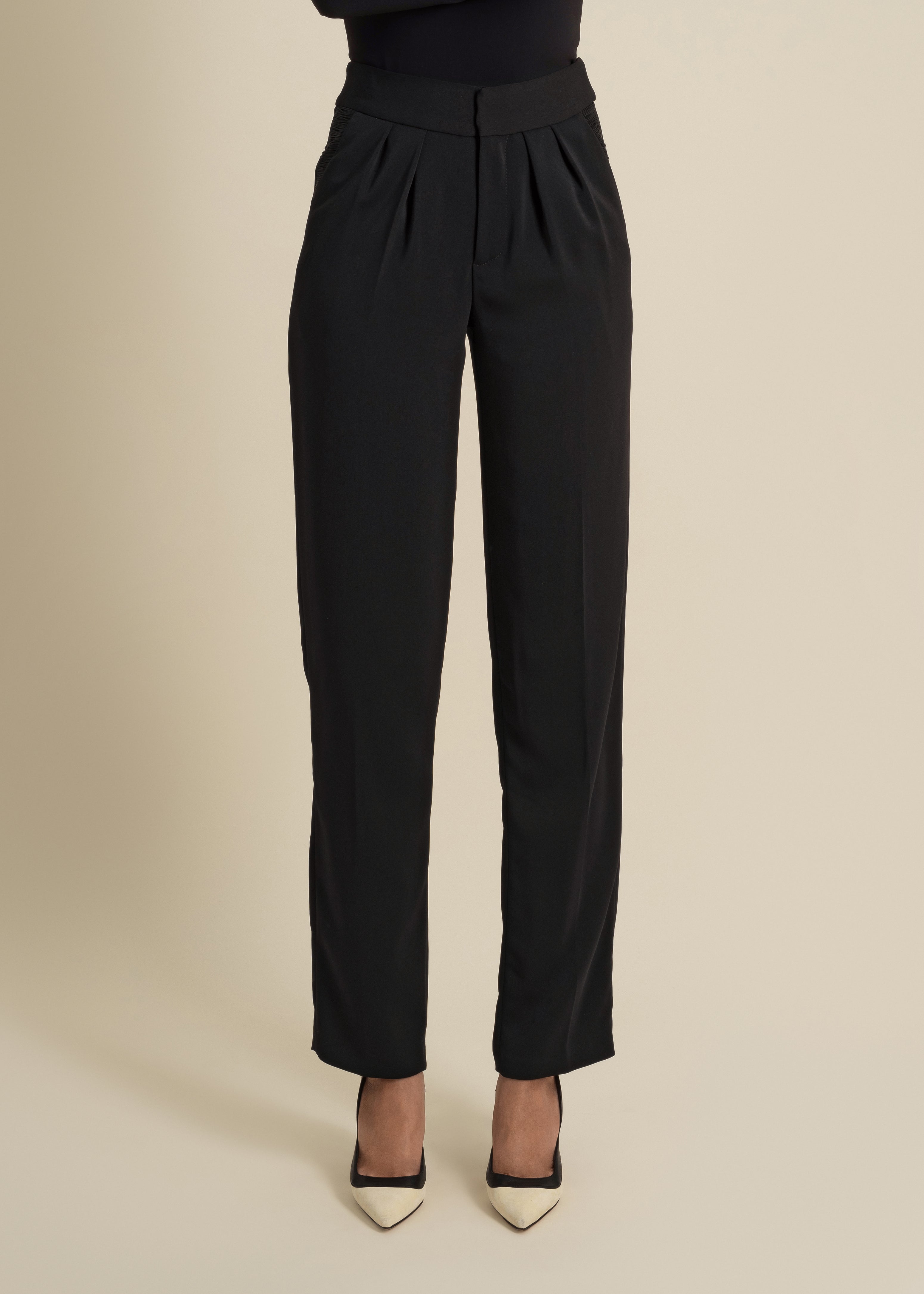 loose-fitted trousers with fringe accent